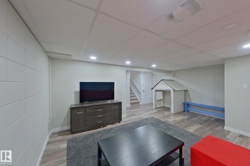 Spacious room featuring light-colored walls, recessed lighting, and wood-look flooring - 184 Cornell Court, Edmonton, AB - Indoor Photo Showing Other Room