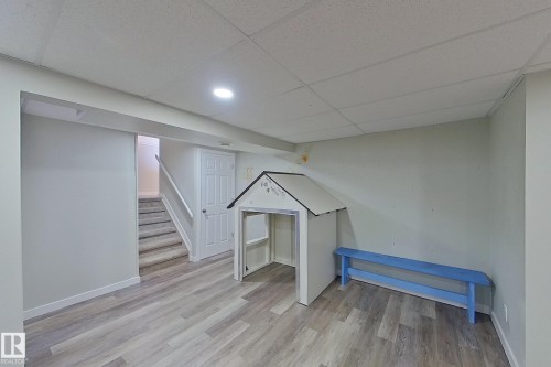 This spacious room features light-toned flooring, white walls, and recessed lighting - 184 Cornell Court, Edmonton, AB - Indoor Photo Showing Other Room