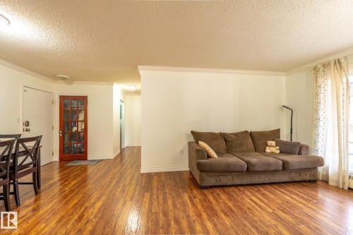 142 10636 120 Street, Edmonton, AB - Indoor Photo Showing Living Room