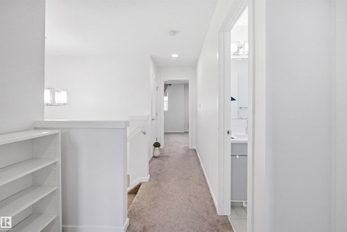 Hallway with neutral carpeting and recessed lighting - 7782 174A Avenue, Edmonton, AB - Indoor Photo Showing Other Room
