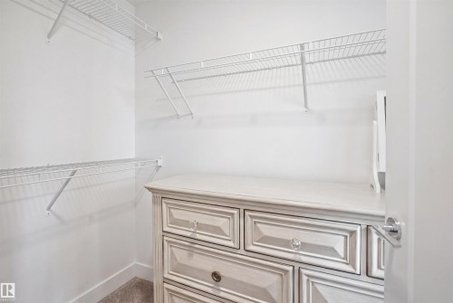 White wire shelving system provides ample storage - 7782 174A Avenue, Edmonton, AB - Indoor With Storage