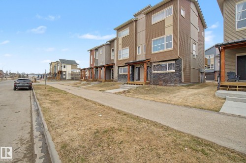 121 401 Southfork Drive, Leduc, AB - Outdoor With Facade