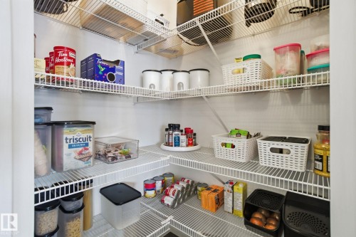 The pantry features extensive wire shelving for organized storage - 2553 Coughlan Road, Edmonton, AB - Indoor