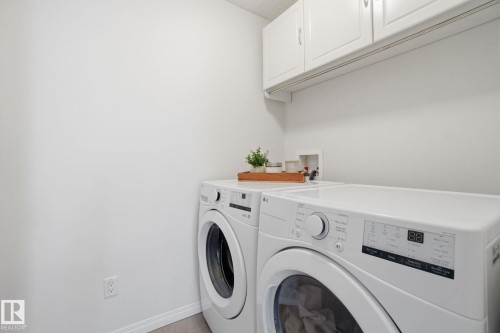 Laundry area featuring white cabinetry and light-colored walls - 2553 Coughlan Road, Edmonton, AB - Indoor Photo Showing Laundry Room