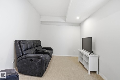 This room features light-colored walls and carpeting, with a recessed light visible in the ceiling - 2553 Coughlan Road, Edmonton, AB - Indoor
