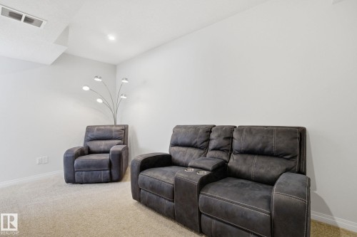 This room features light-colored walls and plush carpeting - 2553 Coughlan Road, Edmonton, AB - Indoor Photo Showing Living Room