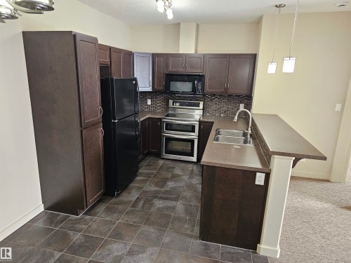 Edmonton, AB - Indoor Photo Showing Kitchen With Double Sink