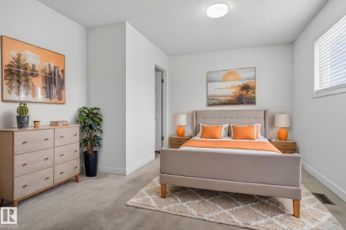 Carpeted bedroom featuring a window with blinds, a ceiling-mounted light fixture, and a neutral color palette - 18604 97A Avenue, Edmonton, AB - Indoor Photo Showing Bedroom