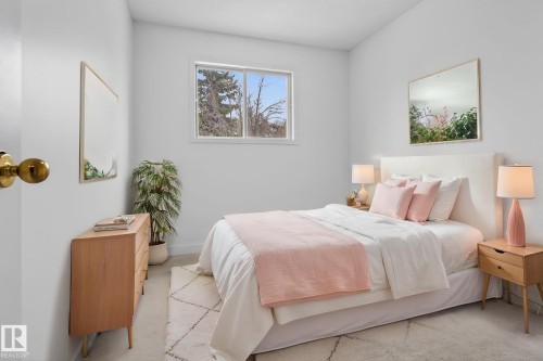 Bright bedroom featuring a single window, light-colored walls, and a visible portion of a light-toned area rug over concrete flooring - 18604 97A Avenue, Edmonton, AB - Indoor Photo Showing Bedroom