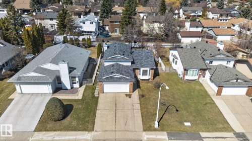 Front exterior featuring a dual-car garage, concrete driveway, and a bay window - 18604 97A Avenue, Edmonton, AB - Outdoor