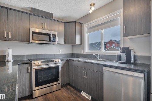 419 Simpkins Link, Leduc, AB - Indoor Photo Showing Kitchen With Stainless Steel Kitchen With Double Sink