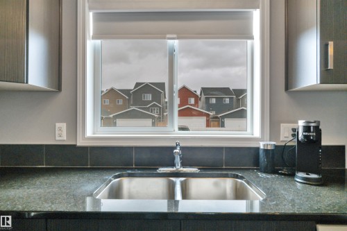 419 Simpkins Link, Leduc, AB - Indoor Photo Showing Kitchen With Double Sink
