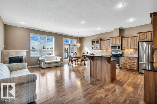 17 12610 15 Avenue, Edmonton, AB - Indoor Photo Showing Kitchen With Fireplace