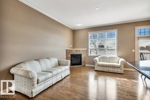 17 12610 15 Avenue, Edmonton, AB - Indoor Photo Showing Living Room With Fireplace