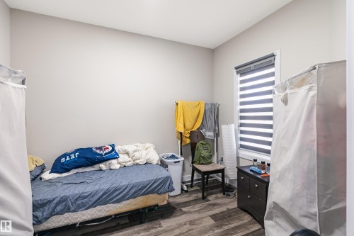 Room featuring light grey walls and wood-finish flooring - 2 Edison Drive, St. Albert, AB - Indoor