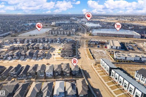 Aerial perspective showcasing a residential area with diverse architectural styles, including single-family homes and multi-unit townhouses - 2 Edison Drive, St. Albert, AB - Outdoor With View