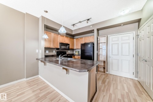 1-304 4245 139 Avenue, Edmonton, AB - Indoor Photo Showing Kitchen With Double Sink