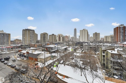 Urban skyline featuring multiple high-rise buildings and surrounding commercial structures - 701 10135 116 Street Nw, Edmonton, AB - Outdoor With View