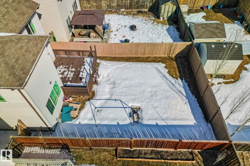 The property features a fenced backyard with a wooden deck and a gazebo - 1115 61 Street, Edmonton, AB - Outdoor With Exterior