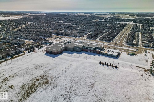 Aerial view showcasing the property's location within a developed neighborhood, featuring many residential buildings and roads - 1115 61 Street, Edmonton, AB - Outdoor With View