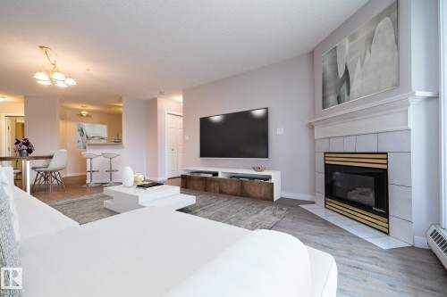 112 11716 100 Avenue, Edmonton, AB - Indoor Photo Showing Living Room With Fireplace