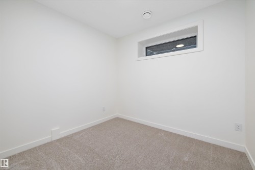 Neutral tone carpeting - 11418 96 Street, Edmonton, AB - Indoor Photo Showing Other Room