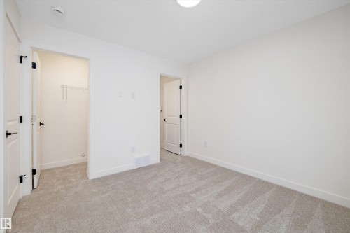 Carpeted room with white walls, baseboards, and ceiling - 11918 93 Street, Edmonton, AB - Indoor Photo Showing Other Room