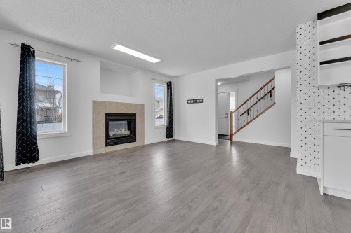 208 79 Street, Edmonton, AB - Indoor Photo Showing Living Room With Fireplace