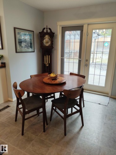 Hard surface flooring with light-toned walls - 59 Rue Monette, Beaumont, AB - Indoor Photo Showing Dining Room