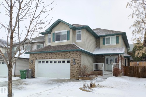 Two-story residence featuring a brick facade on the lower level and siding on the upper level - 59 Rue Monette, Beaumont, AB - Outdoor With Facade