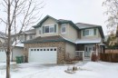 Two-story residence featuring a brick facade on the lower level and siding on the upper level - 59 Rue Monette, Beaumont, AB  - Outdoor With Facade 