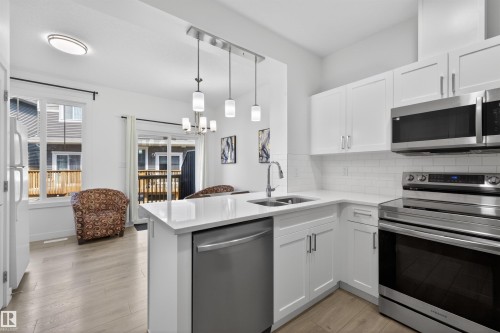 51 603 Orchards Boulevard Sw, Edmonton, AB - Indoor Photo Showing Kitchen With Double Sink With Upgraded Kitchen