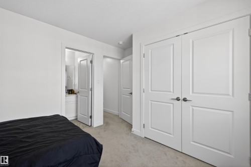 Neutral wall paint throughout - 51 603 Orchards Boulevard Sw, Edmonton, AB - Indoor Photo Showing Bedroom
