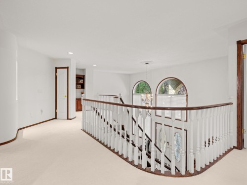 Hall featuring an upstairs landing, a chandelier, light carpet, and recessed lighting - 29 Oakdale Place, St. Albert, AB - Indoor Photo Showing Other Room