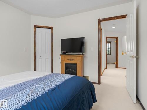 Bedroom featuring light carpet and a closet - 29 Oakdale Place, St. Albert, AB - Indoor Photo Showing Bedroom