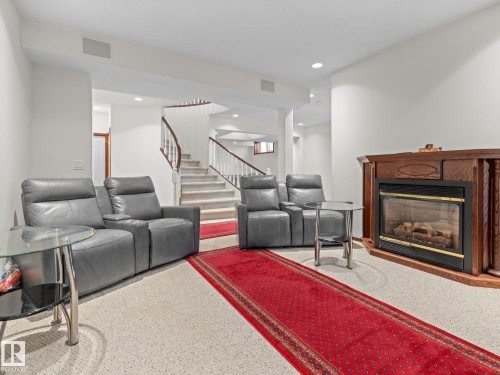 Home theater room featuring a glass covered fireplace and recessed lighting - 29 Oakdale Place, St. Albert, AB - Indoor Photo Showing Living Room With Fireplace