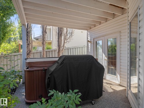 View of patio / terrace featuring a hot tub and french doors - 29 Oakdale Place, St. Albert, AB - Outdoor With Exterior