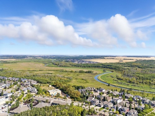 Aerial view of residential area featuring a heavily wooded area and a large body of water - 29 Oakdale Place, St. Albert, AB - Outdoor With View