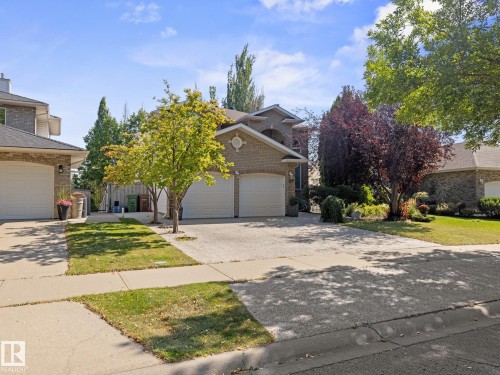 Traditional home with concrete driveway, brick siding, and a front lawn - 29 Oakdale Place, St. Albert, AB - Outdoor