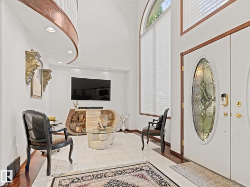 Foyer entrance with a towering ceiling, light tile patterned flooring, and recessed lighting - 29 Oakdale Place, St. Albert, AB - Indoor Photo Showing Other Room