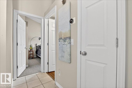 The interior hallway features light beige walls, white trim, and doors - 3518 18 Street, Edmonton, AB - Indoor