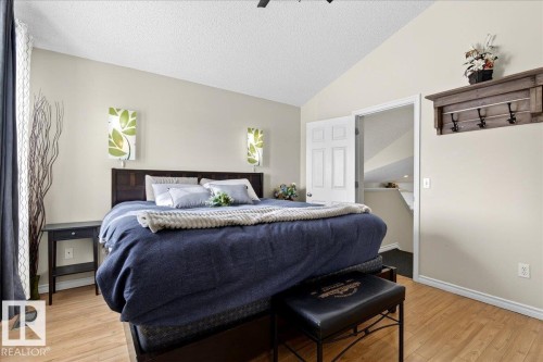 Bedroom featuring vaulted ceilings and light wood-style flooring - 3518 18 Street, Edmonton, AB - Indoor Photo Showing Bedroom