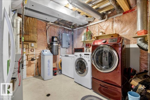 Utility room with concrete flooring, exposed ceiling beams, and visible plumbing and electrical systems - 3518 18 Street, Edmonton, AB - Indoor Photo Showing Laundry Room