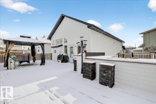 The property features an extensive deck with a railing, a gazebo, and exterior lighting fixtures - 3518 18 Street, Edmonton, AB - Outdoor With Exterior