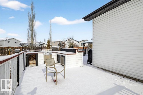 The property features a spacious deck with a built-in outdoor kitchen, complete with a grill - 3518 18 Street, Edmonton, AB - Outdoor With Exterior