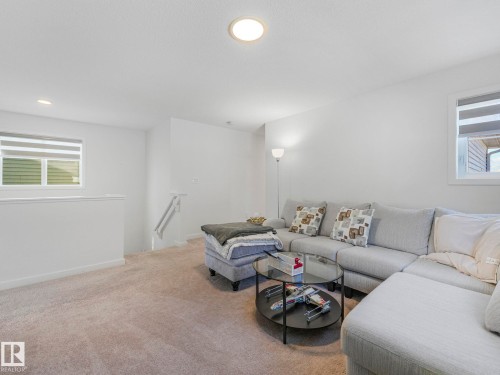 Carpeted room featuring recessed lighting, white walls, and white trim - 4851 Kinney Road, Edmonton, AB - Indoor Photo Showing Living Room