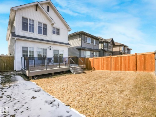 Expansive backyard with a full-height wood fence - 4851 Kinney Road, Edmonton, AB - Outdoor With Deck Patio Veranda