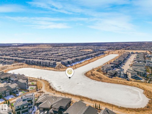 Aerial perspective showcasing a residential area with a prominent frozen body of water - 4851 Kinney Road, Edmonton, AB - Outdoor With View