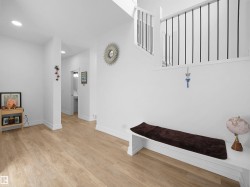 Bright interior space featuring light-toned flooring and white walls, with recessed lighting - 