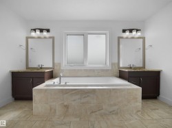 This bathroom features a spacious built-in bathtub with tiled surround, a window providing natural light, and two separate vanity areas with dark wood cabinetry, granite countertops, and mirrors illuminated by wall-mounted light fixtures - 